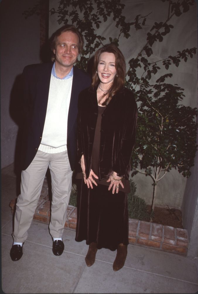 Michael Tylo in khakis and navy blazer with Hunter Tylo in brown velvet outfit - photo print.
