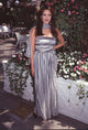 Hunter Tylo photo print in a black and white striped dress with matching scarf.