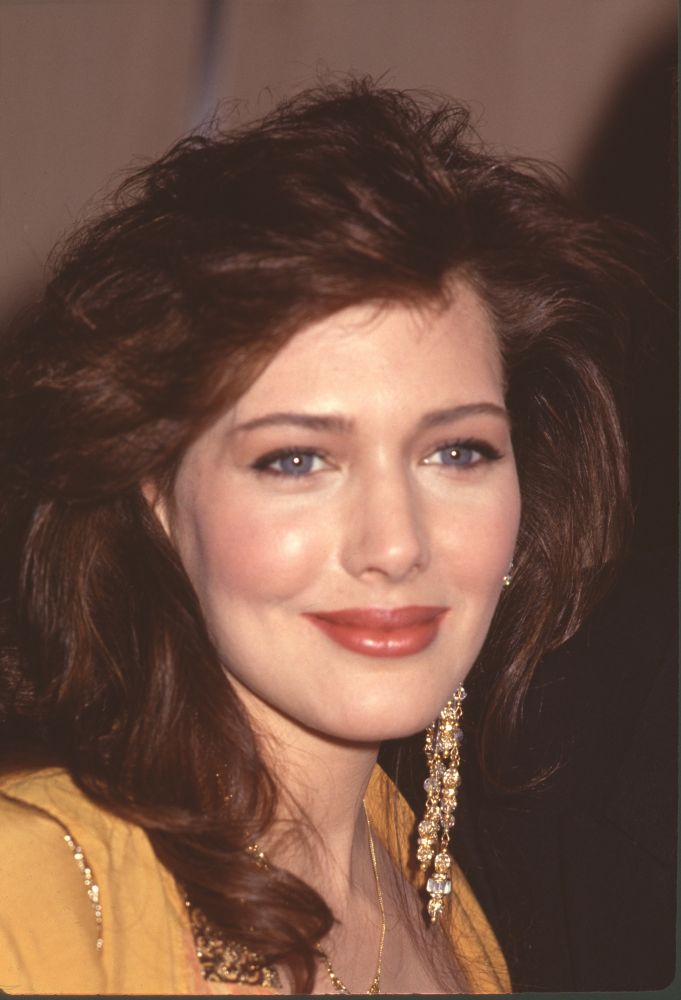Close-up photo print of Hunter Tylo in yellow top with gold earrings
