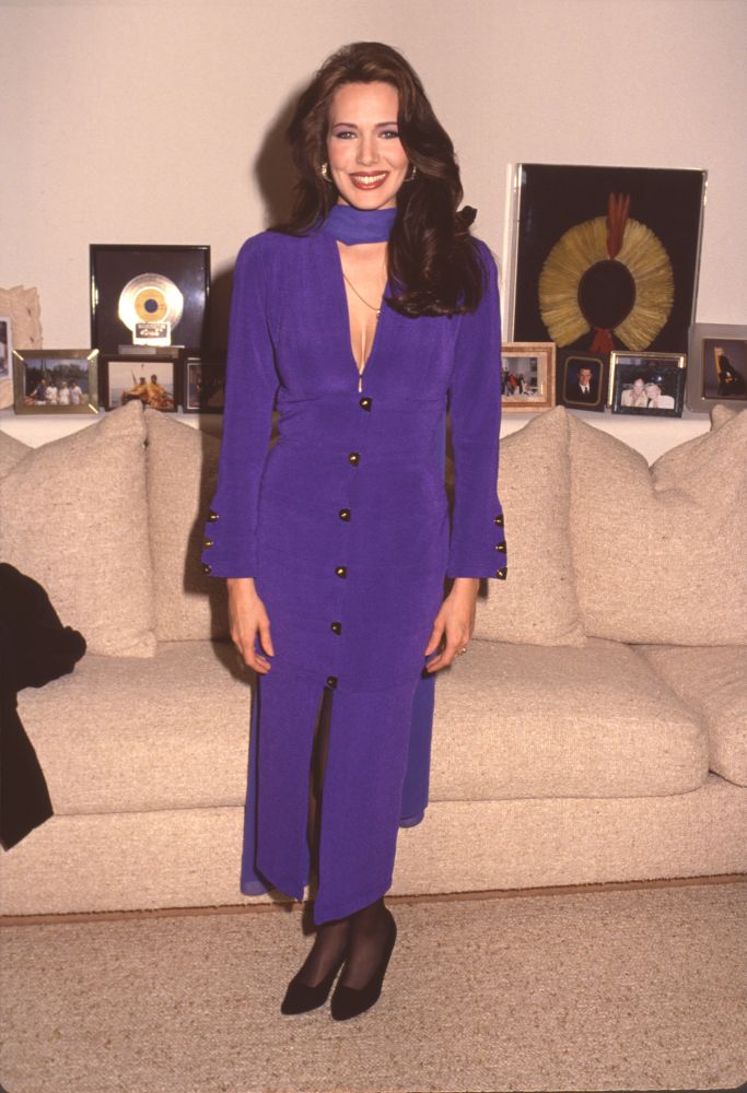 Hunter Tylo in purple dress and scarf at William & Lee Bell's Christmas Party photo print
