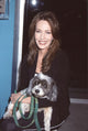Hunter Tylo holding a dog at a book signing event photo print
