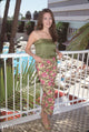 Hunter Tylo photo print in green top and floral pants at Bold & Beautiful luncheon.