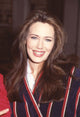 Hunter Tylo close-up photo print in navy and red striped top on Bold and Beautiful set.