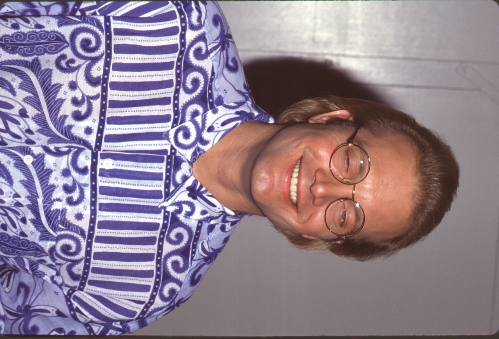 Michael Tylo close-up photo print in white and blue patterned shirt with glasses.