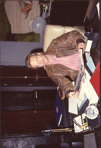 Michael Tylo Sitting at Desk in Brown Leather Jacket Photo Print