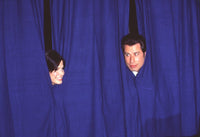Sandra Bullock and John Travolta Peeking Out of Curtain Photo Print