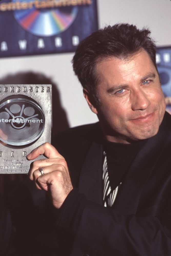 John Travolta close-up photo print holding Blockbuster Award.