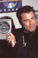 John Travolta close-up photo print holding Blockbuster Award.