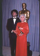 John Travolta in tuxedo and Barbara Stanwyck in red gown at Academy Awards photo print.