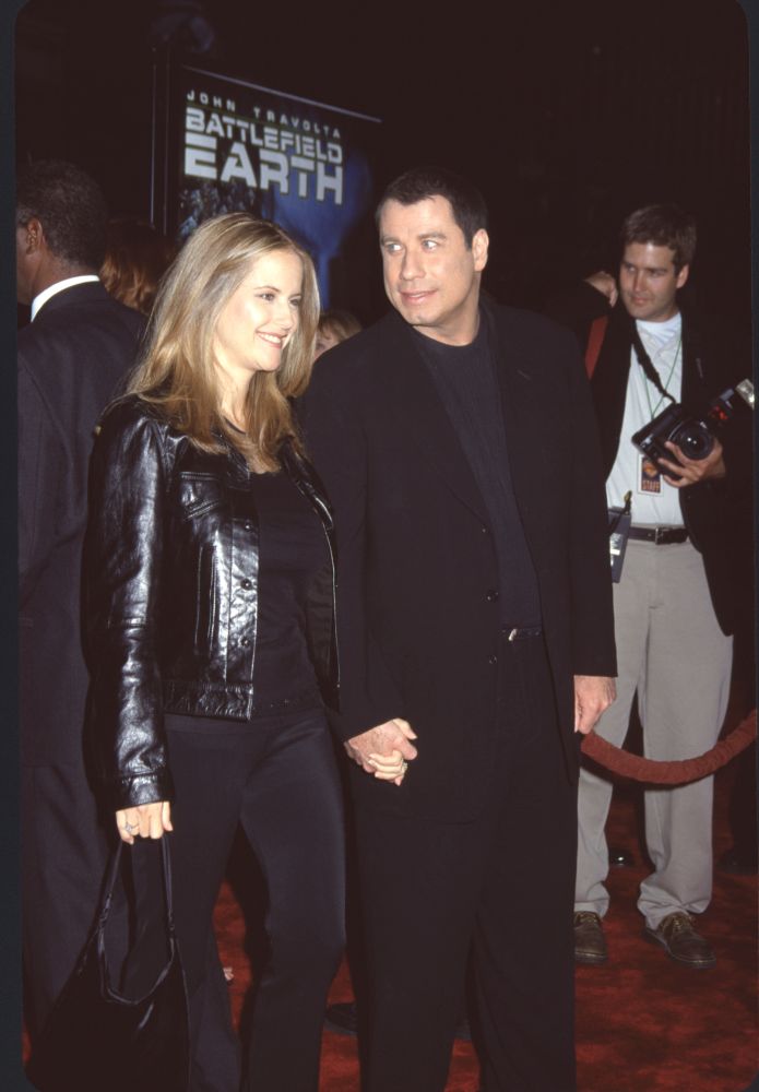 Kelly Preston in black leather jacket with John Travolta in all black at Battlefield Earth premiere photo print.