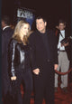 Kelly Preston in black leather jacket with John Travolta in all black at Battlefield Earth premiere photo print.
