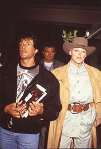 Sylvester Stallone and Brigitte Nielsen iconic photo print featuring stylish outfits.