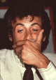 Close up photo print of Sylvester Stallone holding face.