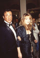 Sylvester Stallone in tuxedo with Cornelia Guest in black ruffle dress photo print.