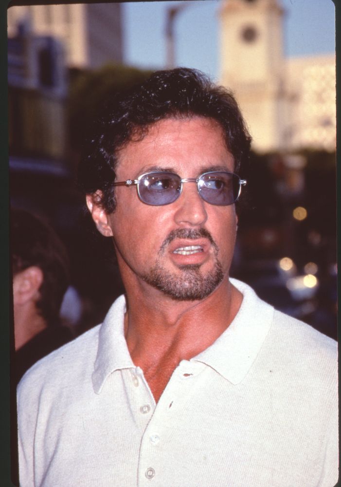Sylvester Stallone close-up photo print at Deep Blue Sea premiere in white shirt and sunglasses.