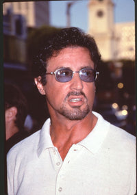 Sylvester Stallone close-up photo print at Deep Blue Sea premiere in white shirt and sunglasses.