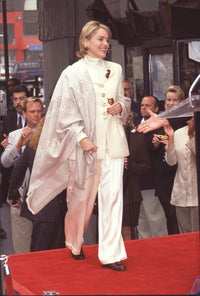 Sharon Stone walking on stage in a white suit at Hollywood Star Ceremony photo print.