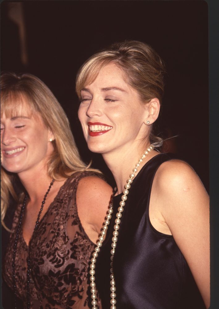 Sharon Stone close-up photo print featuring a silk black top and long pearl necklace.