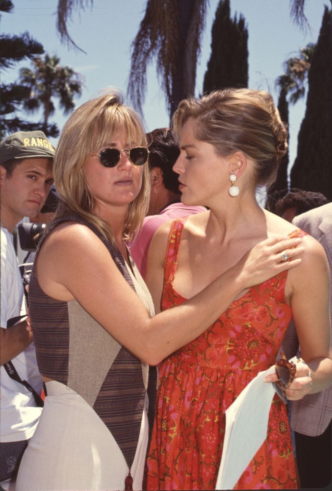 Kelly and Sharon Stone hugging at Plant Hope Benefit - Photo Print