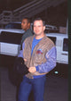 Garth Brooks photo print in jeans and brown leather jacket at Billboard Music Awards.