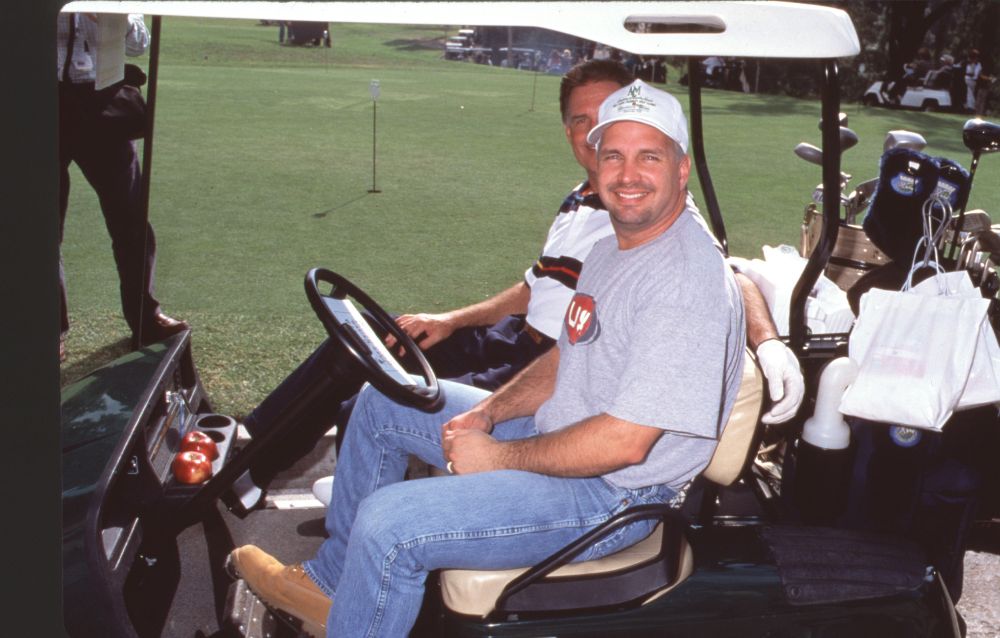 Garth Brooks in golf cart at ACM Golf Tournament photo print