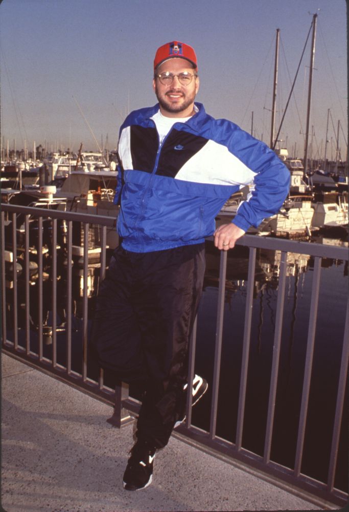 Garth Brooks photo print in black pants and blue & white windbreaker
