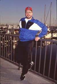 Garth Brooks photo print in black pants and blue & white windbreaker
