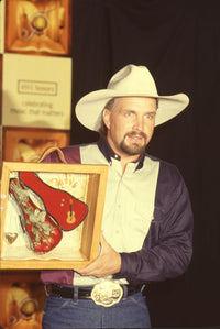 Garth Brooks holding award at the 1st Annual VH1 Honors photo print.