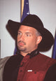 Garth Brooks close-up photo print in red and black at Cop Land Premiere