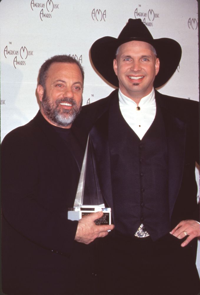 Billy Joel and Garth Brooks holding award at the 26th Annual American Music Awards photo print.