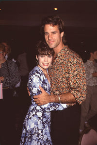 Colleen Dion in blue floral dress hugging Todd McKee photo print