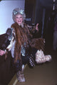 Photo print of Phyllis Diller wearing multiple furs, showcasing classic Hollywood style.