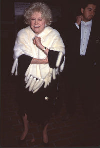 Phyllis Diller wearing black dress and white fur at Gershwin Anniversary Party photo print.