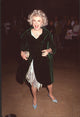 Phyllis Diller photo print in silver dress with green velvet coat