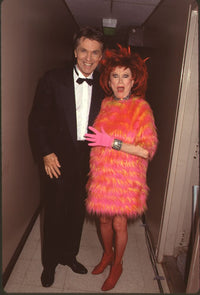Tom Skerritt in tuxedo and Phyllis Diller in orange and pink fur outfit photo print.