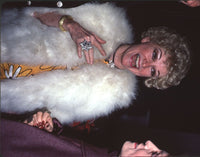 Phyllis Diller photo print in yellow floral dress with white fur.