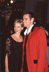 Lauren Holly in black dress and Jim Carrey in red suit jacket at Ace Ventura 2 premiere photo print.