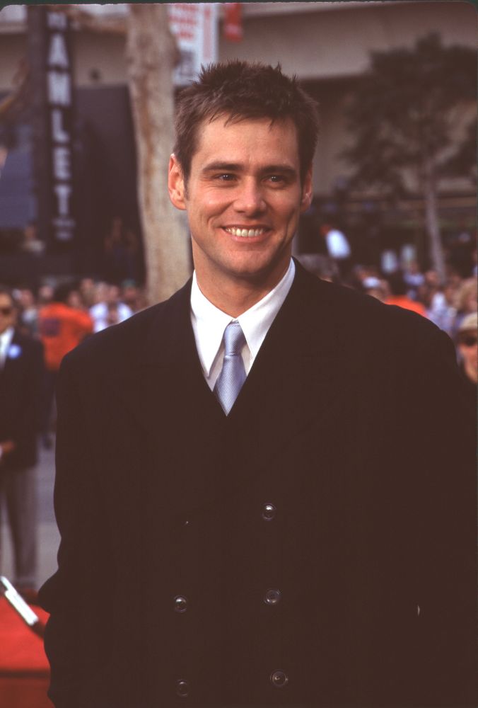 Jim Carrey in black jacket and blue tie at hand and footprint ceremony photo print