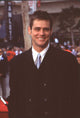 Jim Carrey in black jacket and blue tie at hand and footprint ceremony photo print