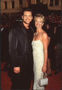 Jim Carrey in black suit with Lauren Holly in white lace dress at The Cable Guy premiere photo print.