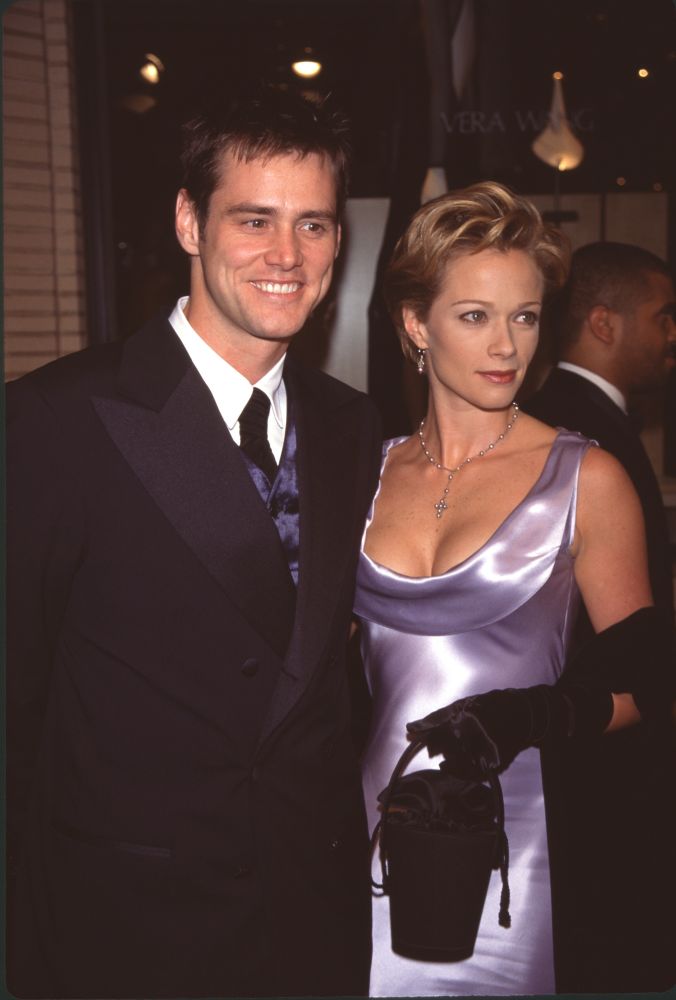 Jim Carrey in black suit with Lauren Holly in black satin dress at Fire & Ice Ball