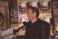 Michael Bolton being interviewed at The Secret of the Lost Kingdom book signing photo print.