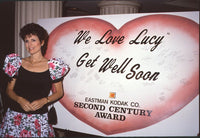 Lucie Arnaz Get Well Soon Card Photo Print featuring iconic 'We Love Lucy' backdrop.