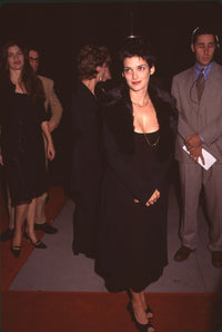 Winona Ryder in black dress and black coat with fur trim at The Crucible premiere photo print.