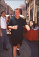 Tom Arnold at Cops and Robbersons Premiere in Black Shorts and Green Top Photo Print