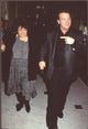 Roseanne Barr in gray dress and black jacket with Tom Arnold in black suit photo print.