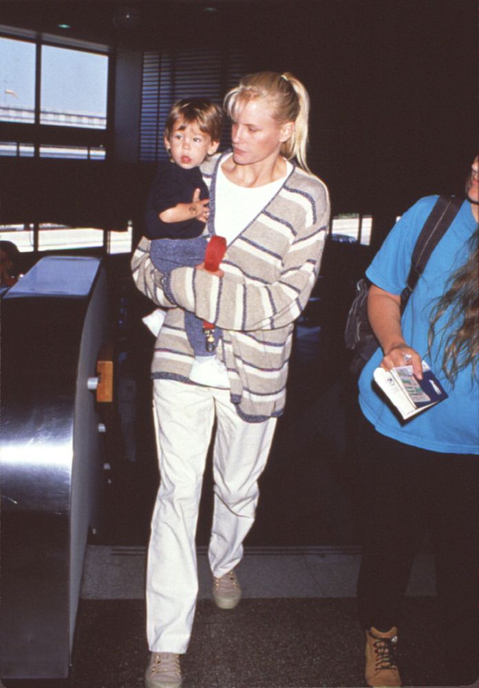 Daryl Hannah Holding Nephew Photo Print, emotional family moment captured.