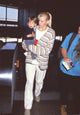 Daryl Hannah Holding Nephew Photo Print, emotional family moment captured.