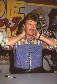 Joe Diffie sitting at a table during Fan Fair - Photo Print