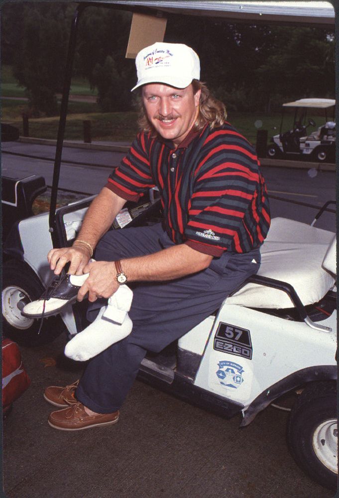 Joe Diffie sitting in a golf cart at ACM's Celebrity Golf Tournament photo print.